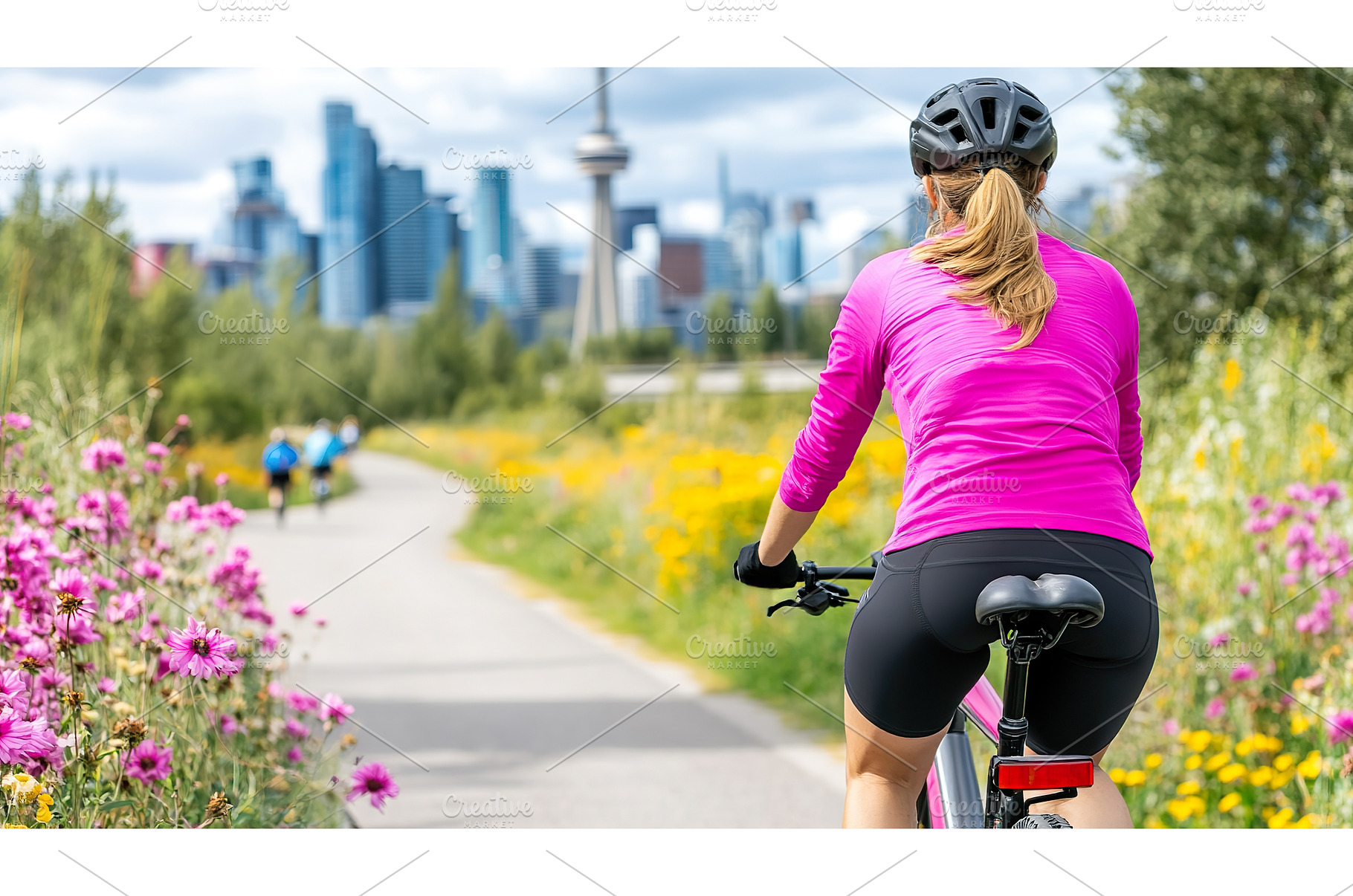 Female cyclist enjoys bicycle ride, a Business Photo by Lermont51