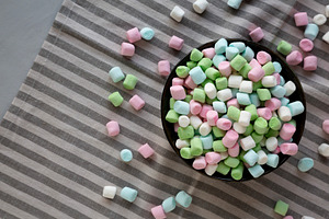 Fruity Colored Rainbow Marshmallows in a Bowl, top view. Copy sp, a Food & Drink Photo by LiudmylaChuhunova