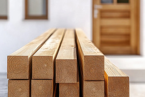 Wooden beams stacked near a door, a Photo by Beautiful things