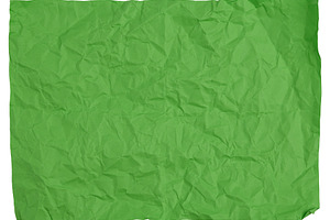 Crumpled green sheet of paper on isolated background, a Background Photo by ndanko