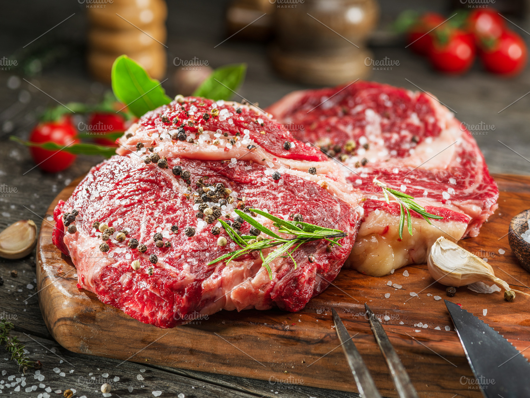 Raw beef steaks with herbs, a Food & Drink Photo by Volff