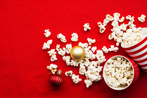 Homemade popcorn for a festive treat containing christmas, background, and