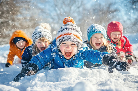 Excited children playing in snow, a Photo by Pavel_design