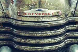 Old truck featuring car, truck, and old