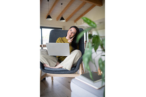 Female freelancer working from home, a Person Photo by HalfPoint