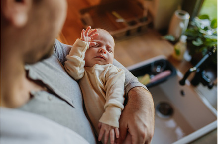 Close-up of father holding his, a Person Photo by HalfPoint