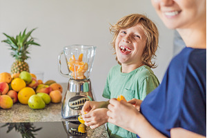 Mother and son cooking together in, a Person Photo by Elizaveta Galitskaya