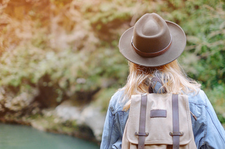 Female traveler walking outdoor.