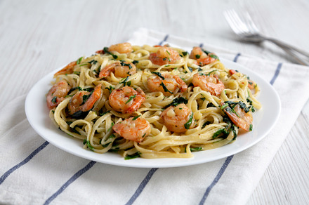Homemade One-Pot Lemon Garlic Shrimp Pasta on a Plate, side view, a Food & Drink Photo by LiudmylaChuhunova