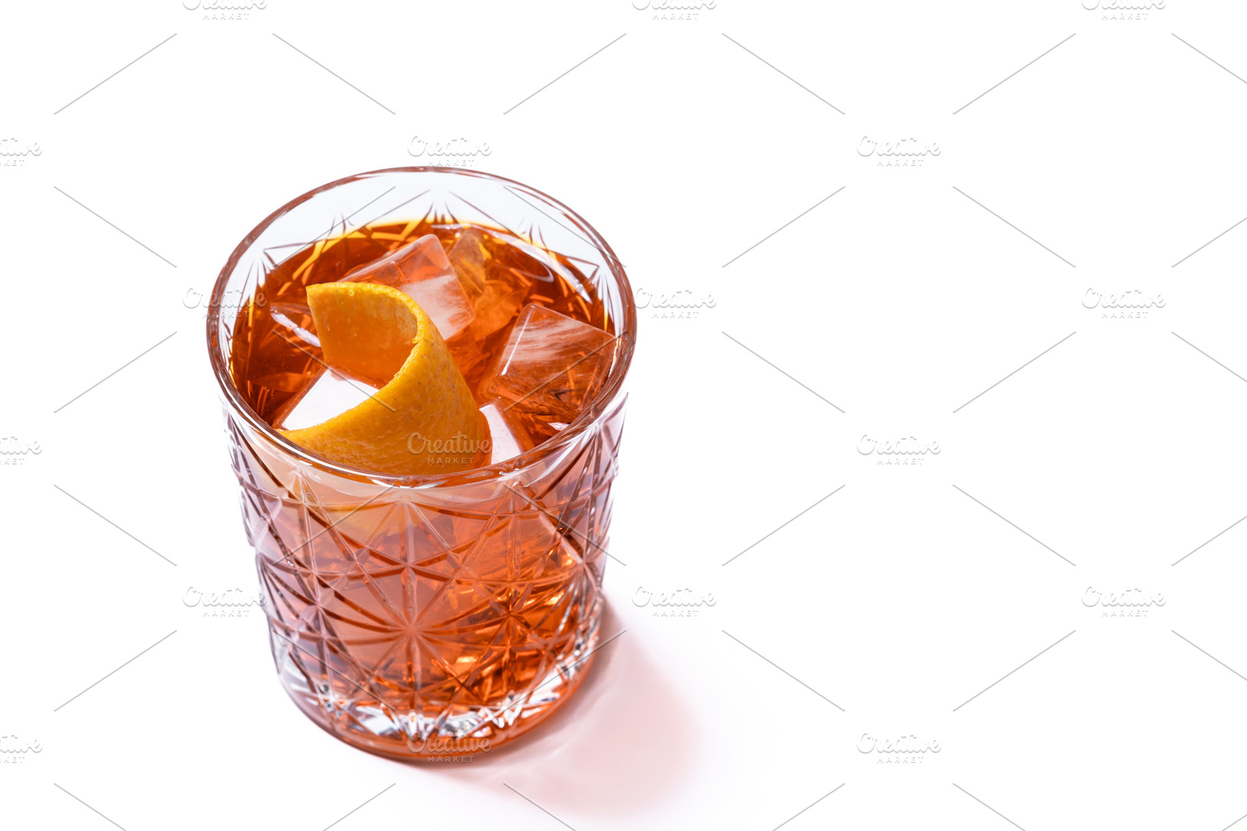 Americano cocktail garnished with twist orange isolated on white, a Food & Drink Photo by etorres69