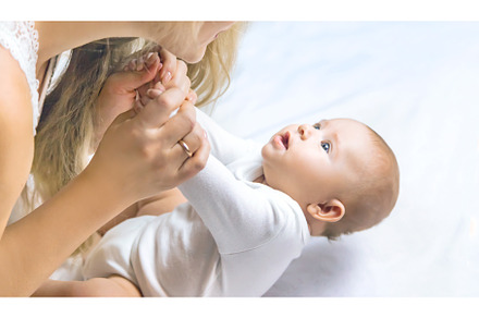 Mother with baby on a light, a Person Photo by yanadjana
