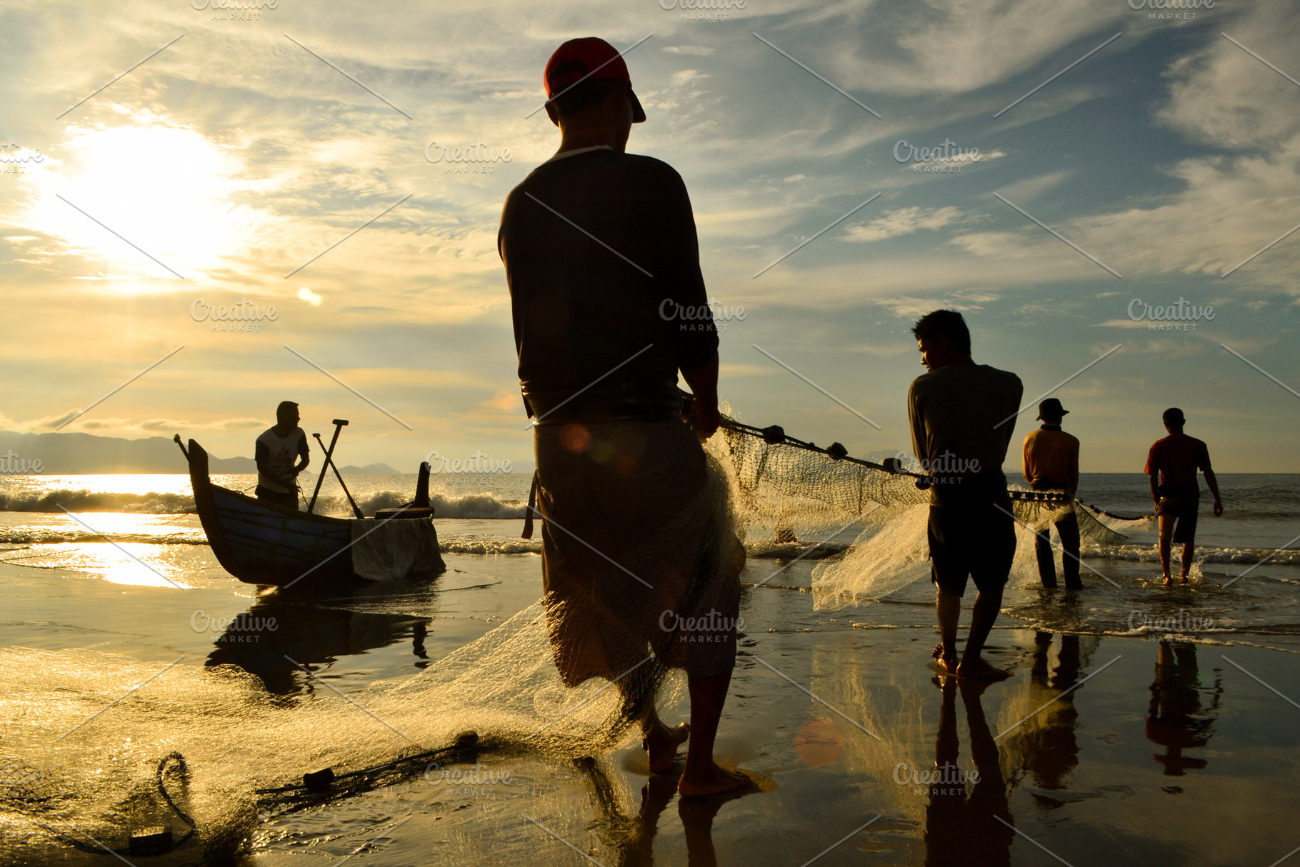 Fishermen Pulling Nets As the SunSet, a Person Photo by bastera