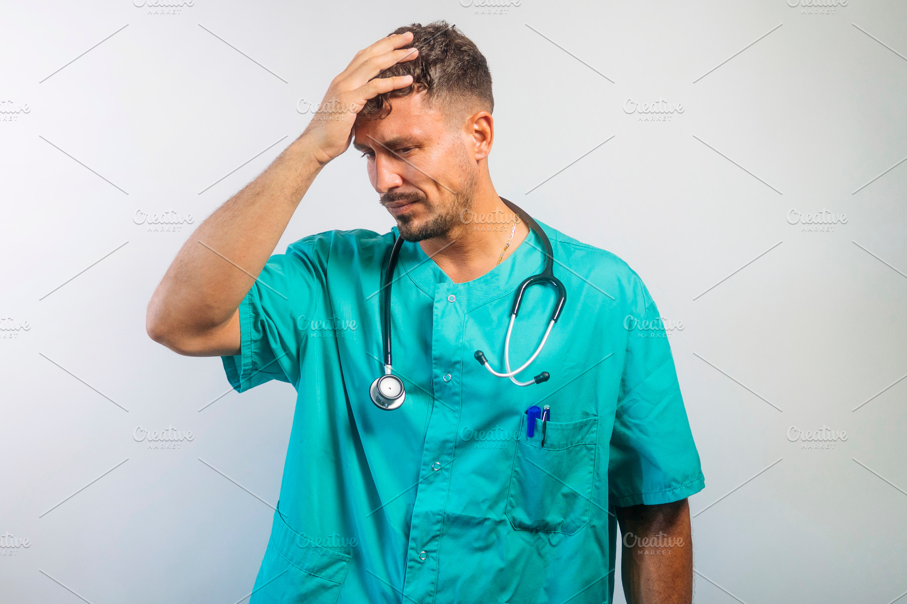 Frustrated Doctor Touching Head with Hand, a Person Photo by karrastock