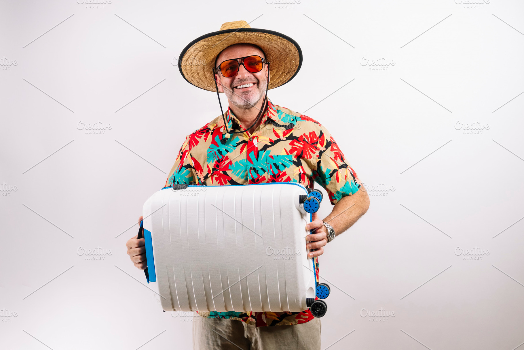 Traveler ready for adventure with suitcase, a Holiday Photo by karrastock