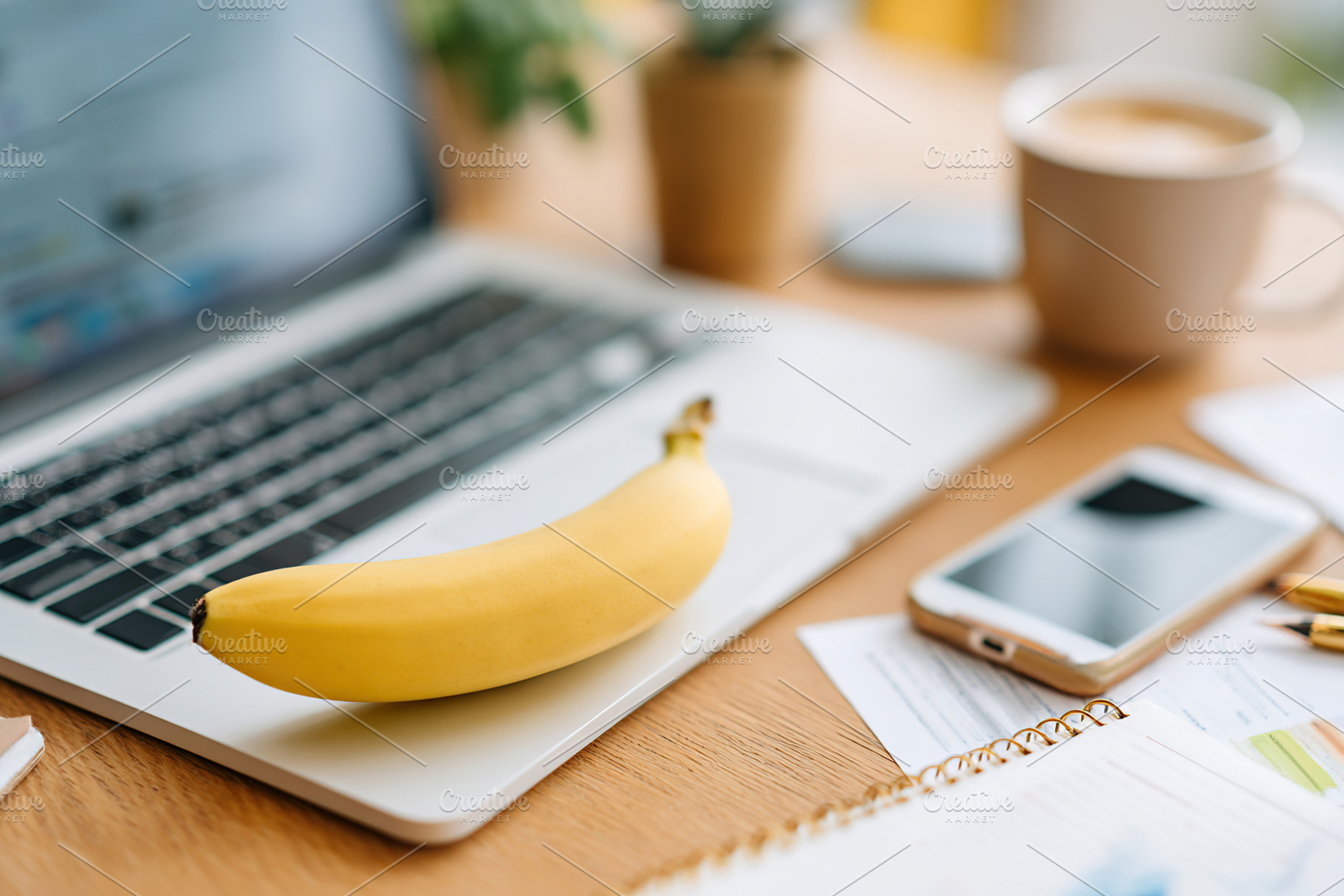 Business presentation setup with laptop, fruit, and office essentials on worksp, a Photo by AlyaAnd
