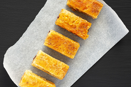 Homemade Baklavas with Honey, Chocolate and Almond on a black ba, a Food & Drink Photo by LiudmylaChuhunova