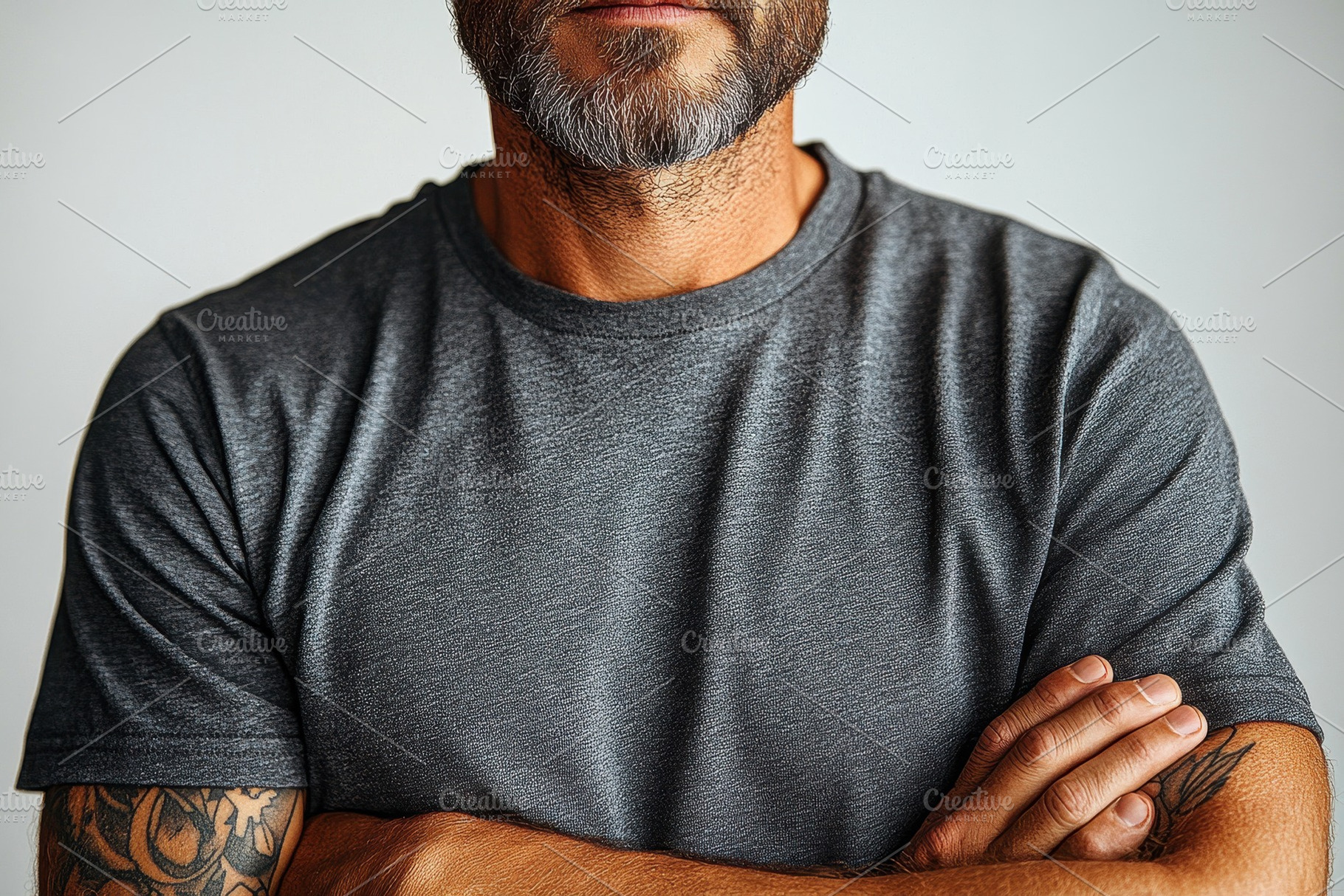 Man with crossed arms and a beard po, a Photo by Tanuart