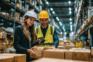 Warehouse workers scanning packages, a Photo by Pixeness Studio