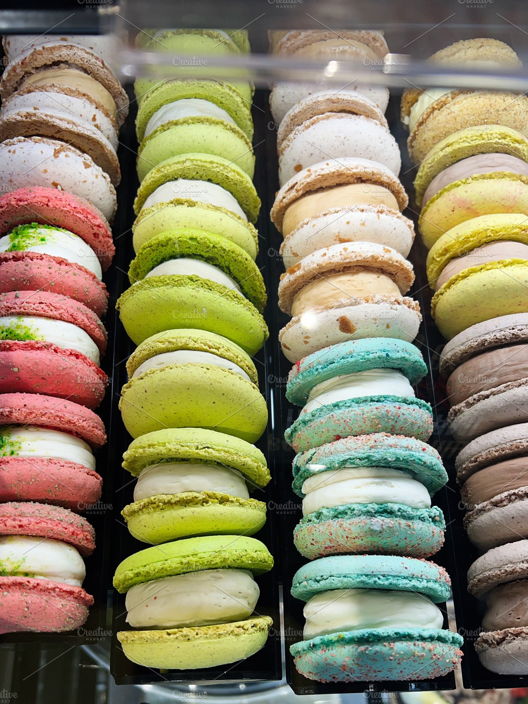 Colorful macarons displayed in a shop showcasing their vibrant assortment and f, a Photo by AS photostudio