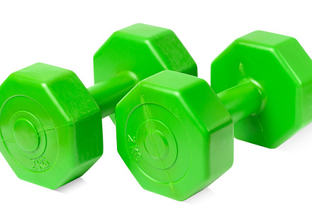 Green plastic dumbbell on a white isolated background, sports eq, a Sports & Recreation Photo by ndanko