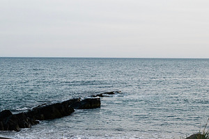 Serene coastal view from Akranes, Iceland under a calm, overcast sky, a Photo by AS photostudio