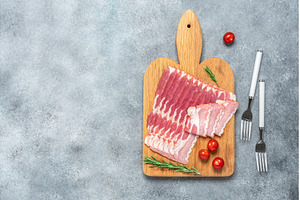 Raw smoked bacon slices on a wooden, a Food & Drink Photo by Yulia71