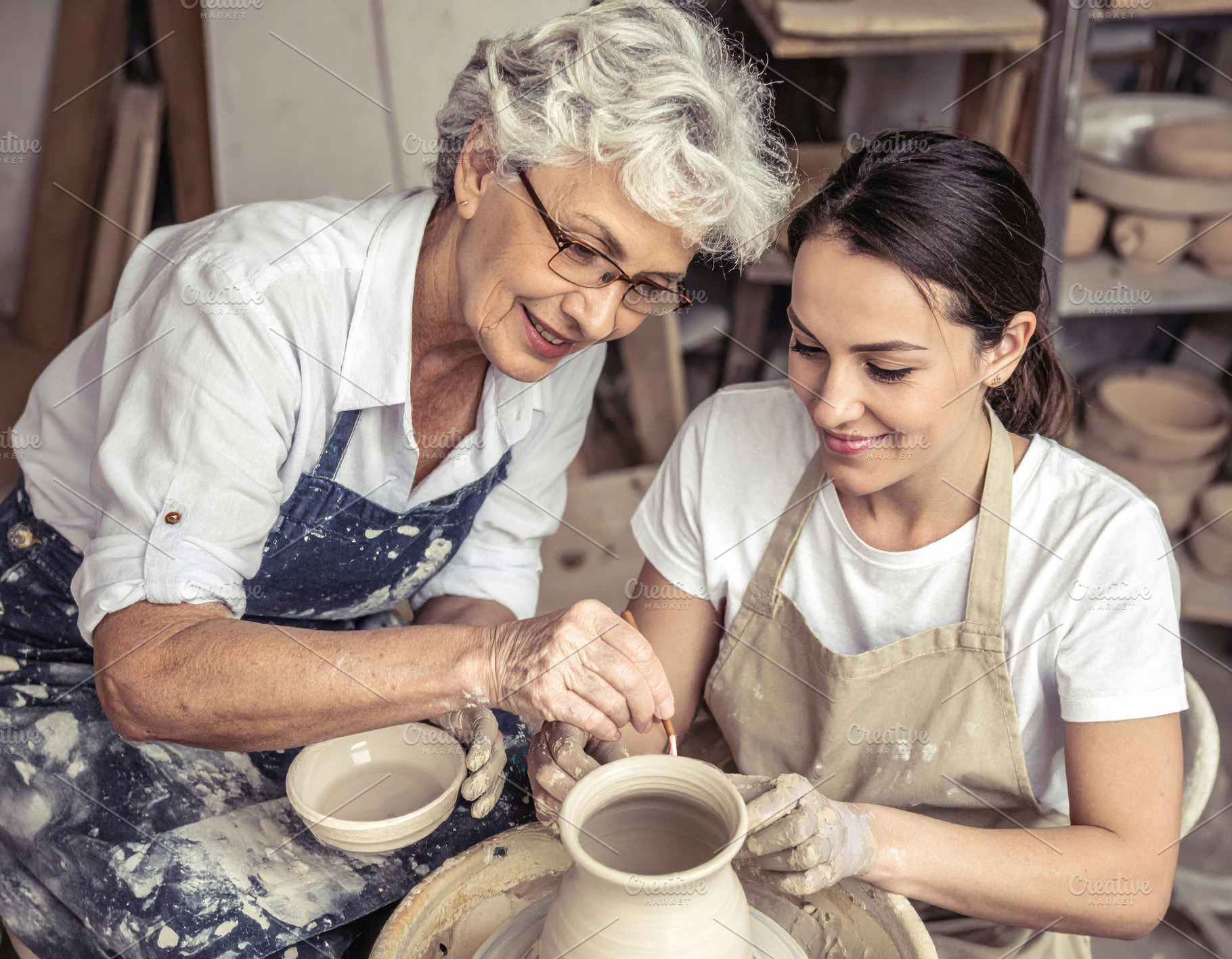 Grandmother Guiding Young Woman in Pottery, an Arts & Entertainment Photo by Davizro's Market