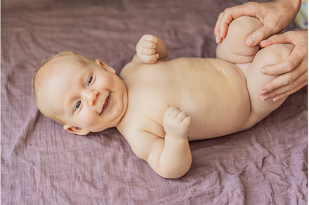 Newborn baby lying on a soft blanket