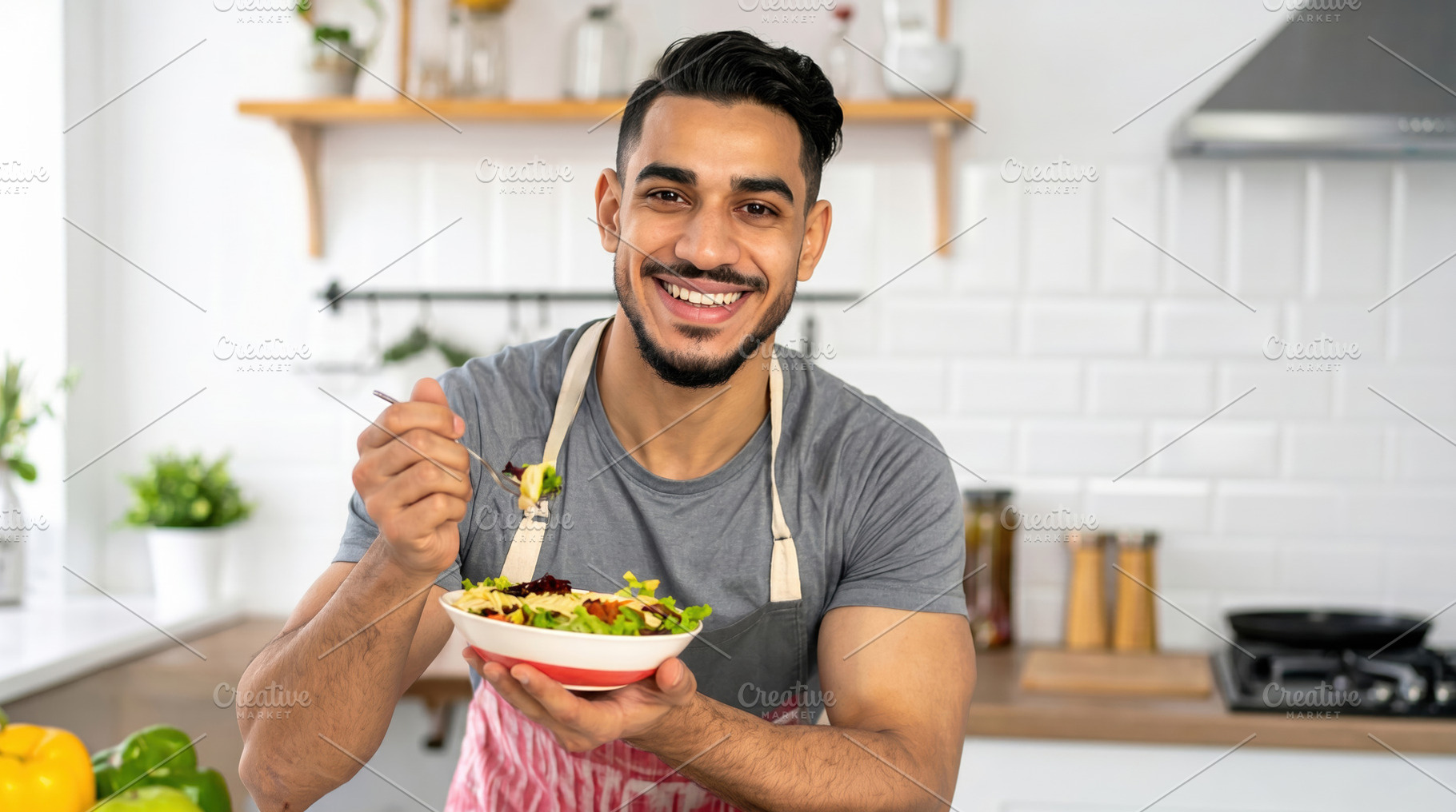 Young Man Eating Fresh Healthy Salad, a Food & Drink Photo by Davizro's Market