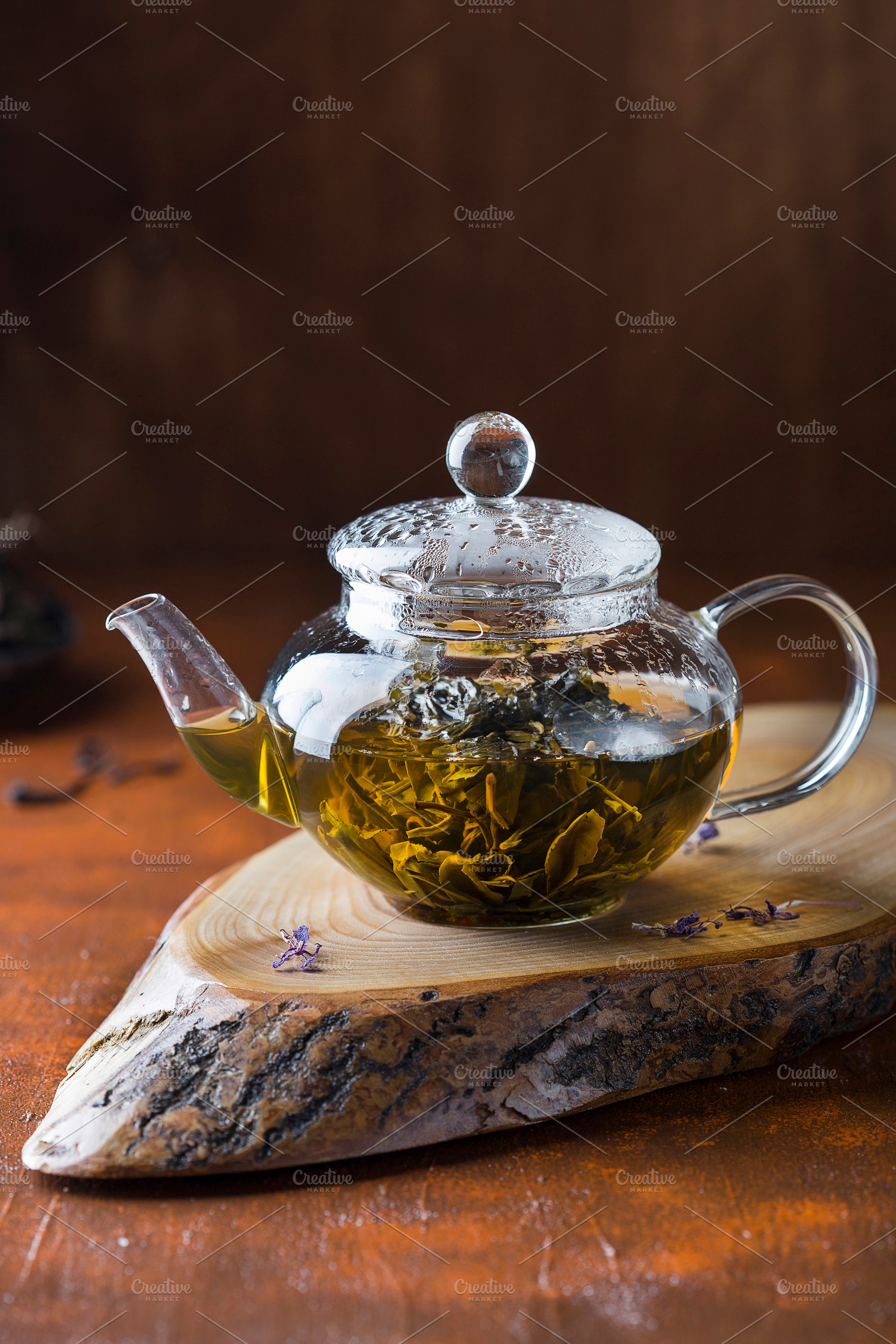 Green tea in a glass teapot featuring antioxidant, aromatic, and background, a Food & Drink Photo by Marina_Pronina