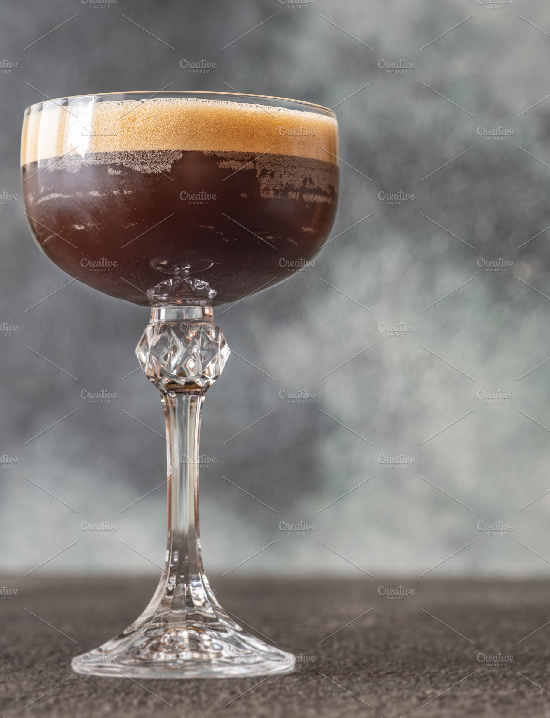 Classic Espresso Martini with thick crema foam and coffee bean g, a Food & Drink Photo by Alexander Prokopenko