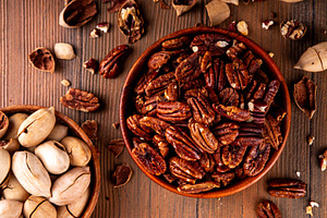 Pecans, peeled and shelled, whole and crushed, a Food & Drink Photo by Rimma