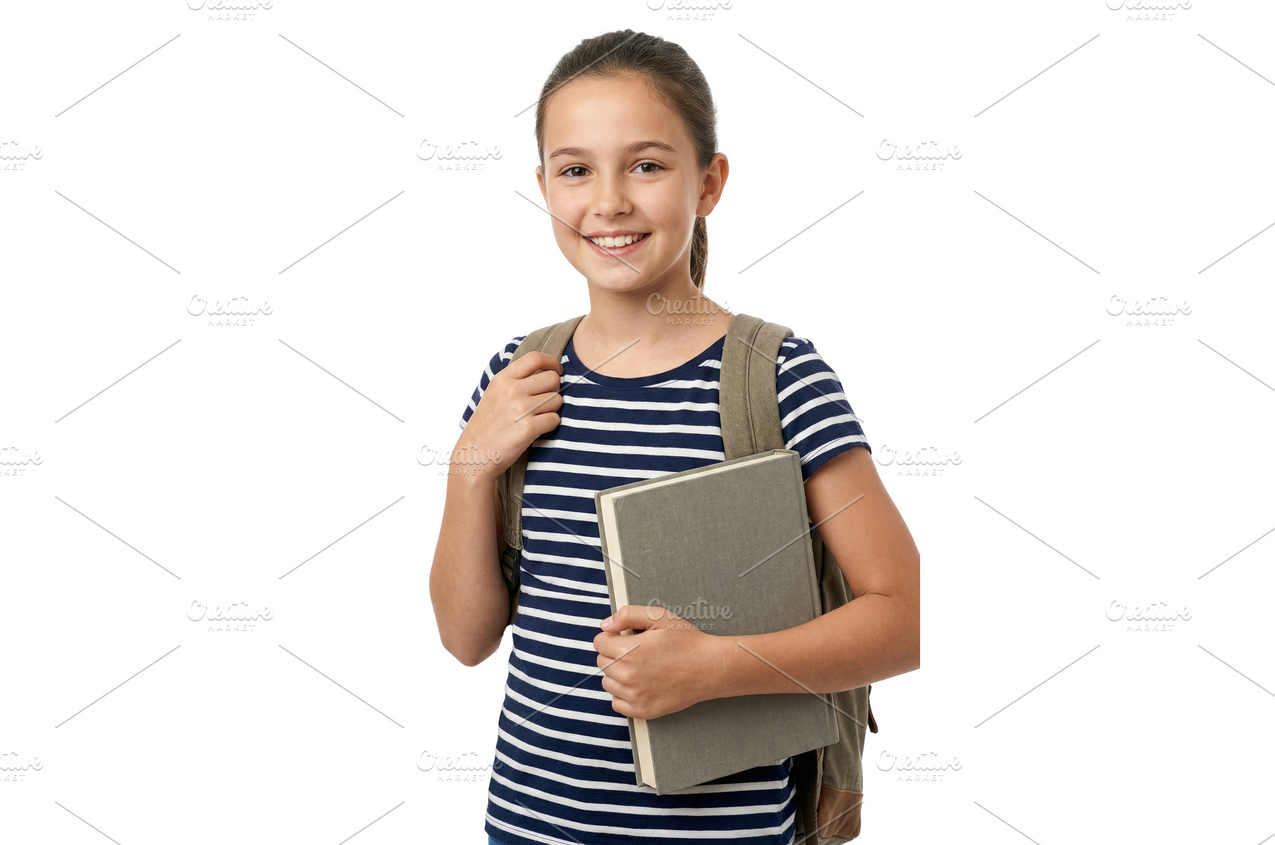 Girl Holding a School Book, a School & Education Photo by CREATIVEDEF