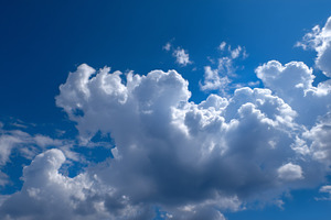Fluffy cumulus clouds drift across, a Nature Photo by MistyDay