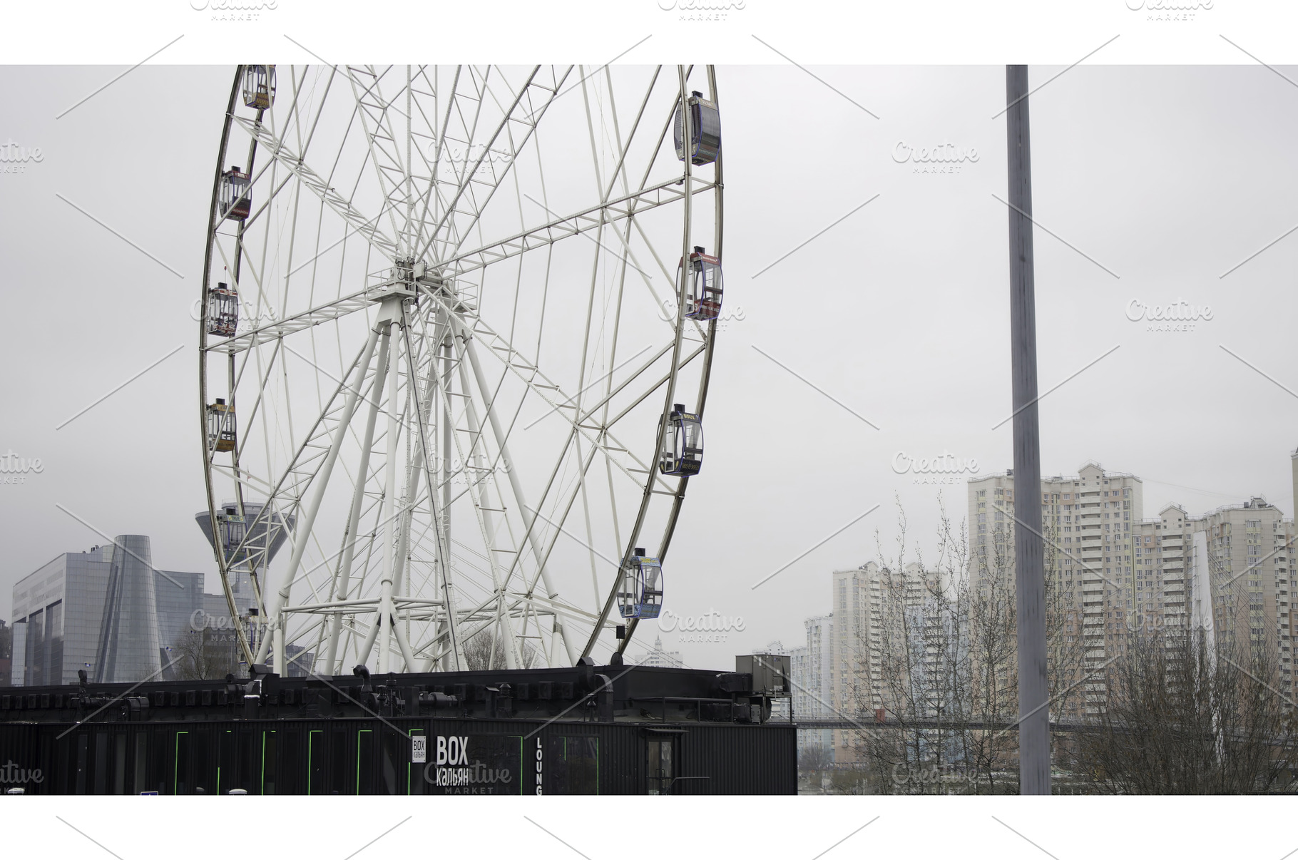Ferris wheel rotating slowly on, an Architecture Photo by Media Whale Stock