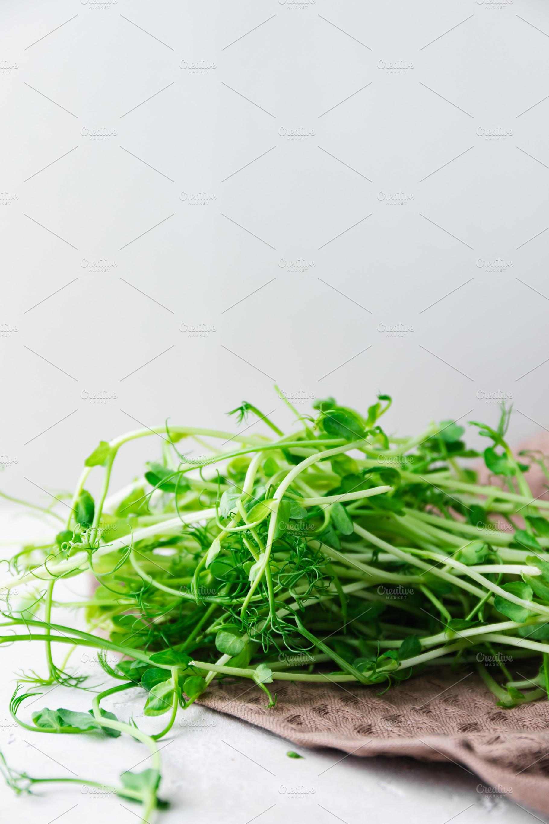 Fresh pea microgreens on a waffle ki, a Food & Drink Photo by Edalin's Store