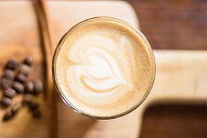 Heart shaped of coffee latte art containing mocha, italian, and cafe