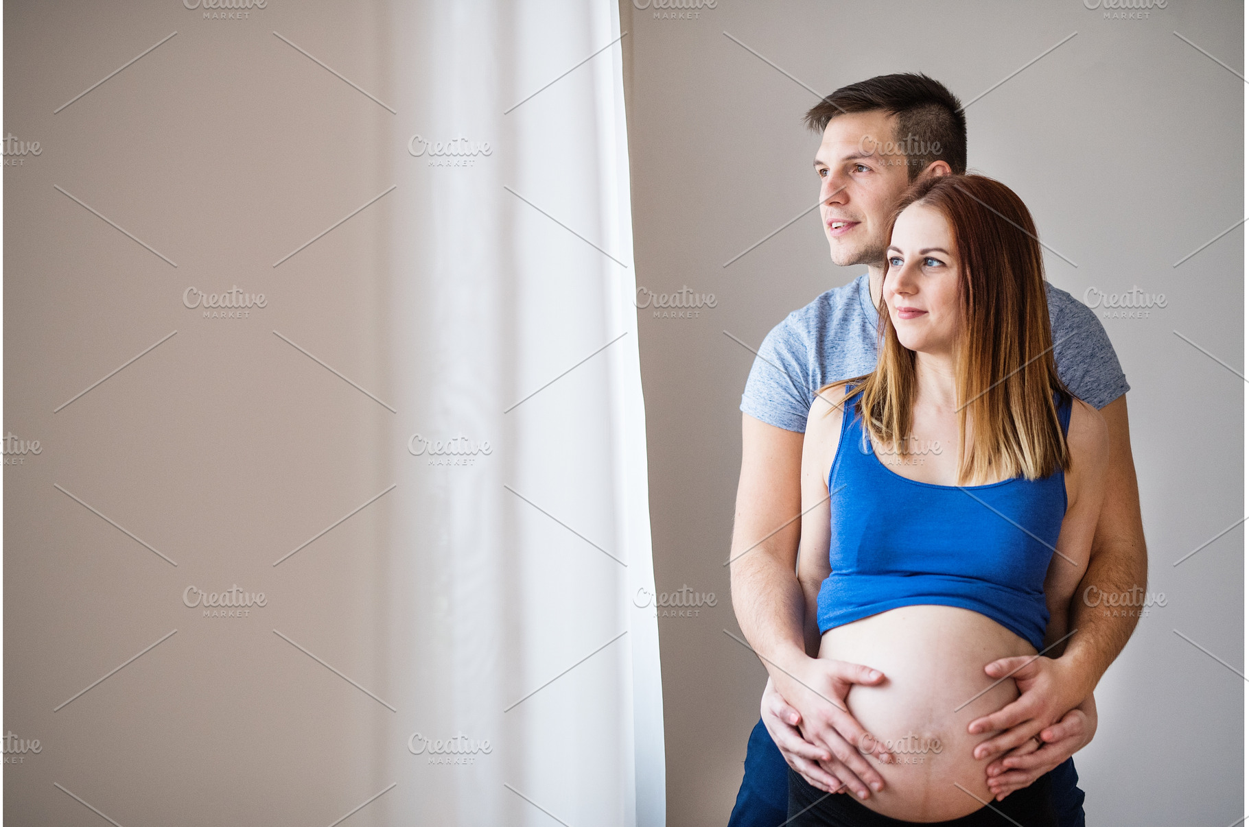 Pregnant woman and her partner, a Person Photo by HalfPoint