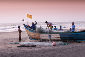 Fishermans picking up their nets, a Photo by saiko3p