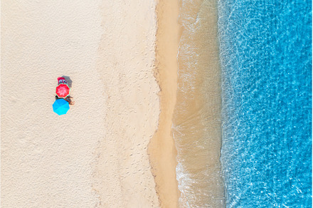Aerial view of colorful umbrellas on, a Nature Photo by den-belitsky