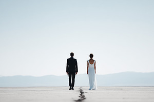 Bride and groom standing apart, a Person Photo by MistyDay