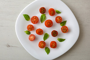 Fresh Sliced Tomatoes and Basil on a White Plate, a Food & Drink Photo by Davizro's Market