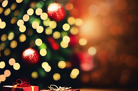 Christmas gifts with blurred festive lights, a Background Photo by Grafvision photography