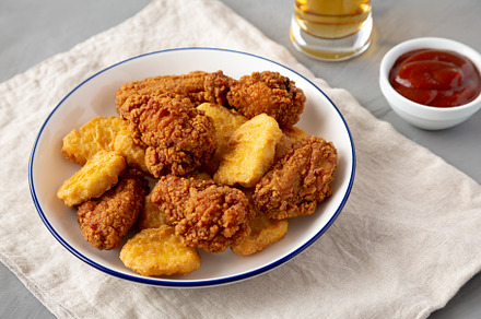Homemade Chicken Nuggets and Chicken Wings with Ketchup and Beer, a Food & Drink Photo by LiudmylaChuhunova