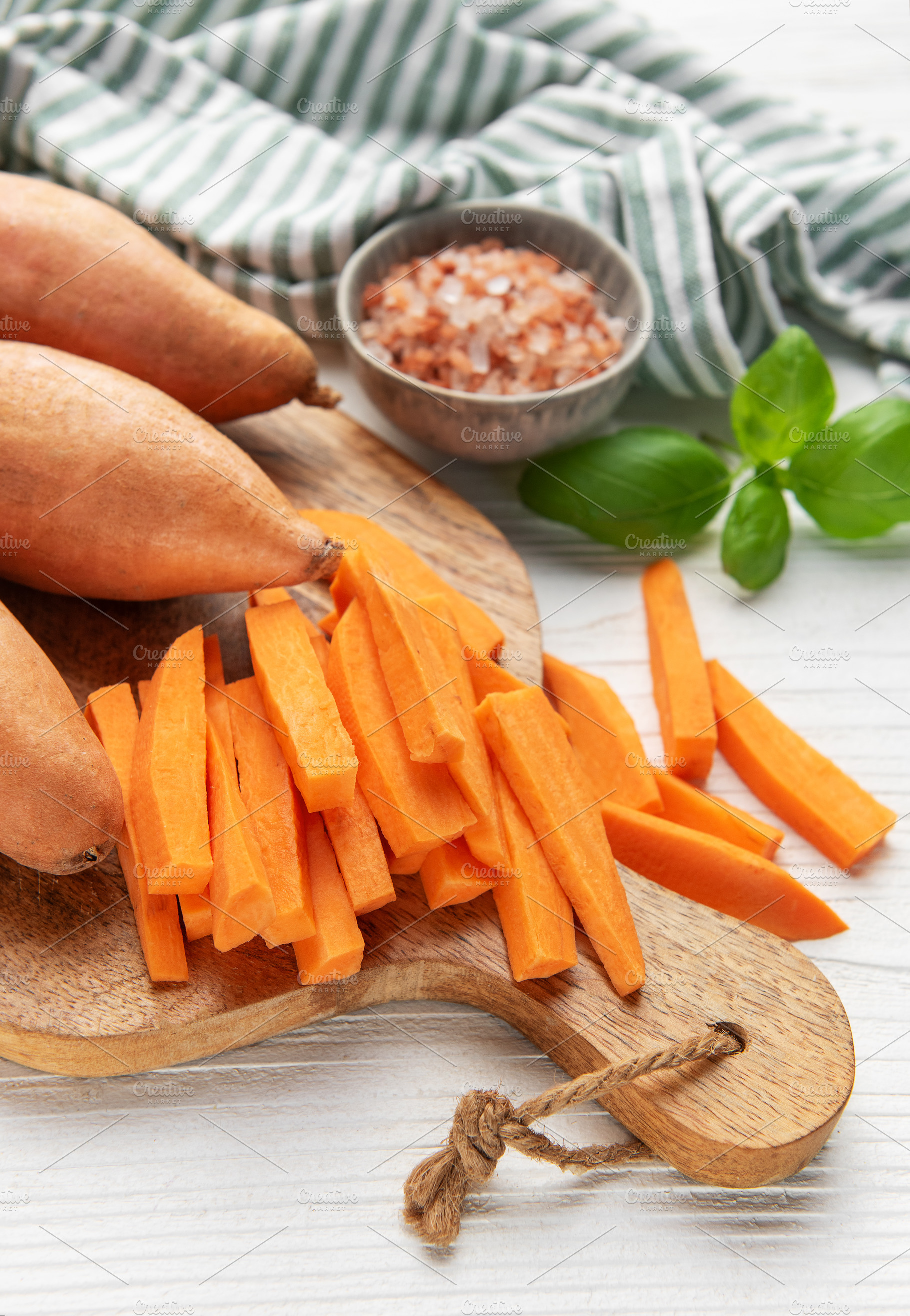 Preparing sweet potato fries on a cutting board, a Food & Drink Photo by Olena Rudo