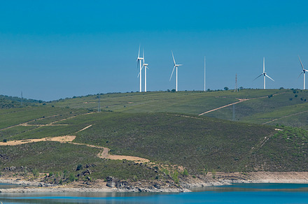 Lake surrounded by hills and arid landscape