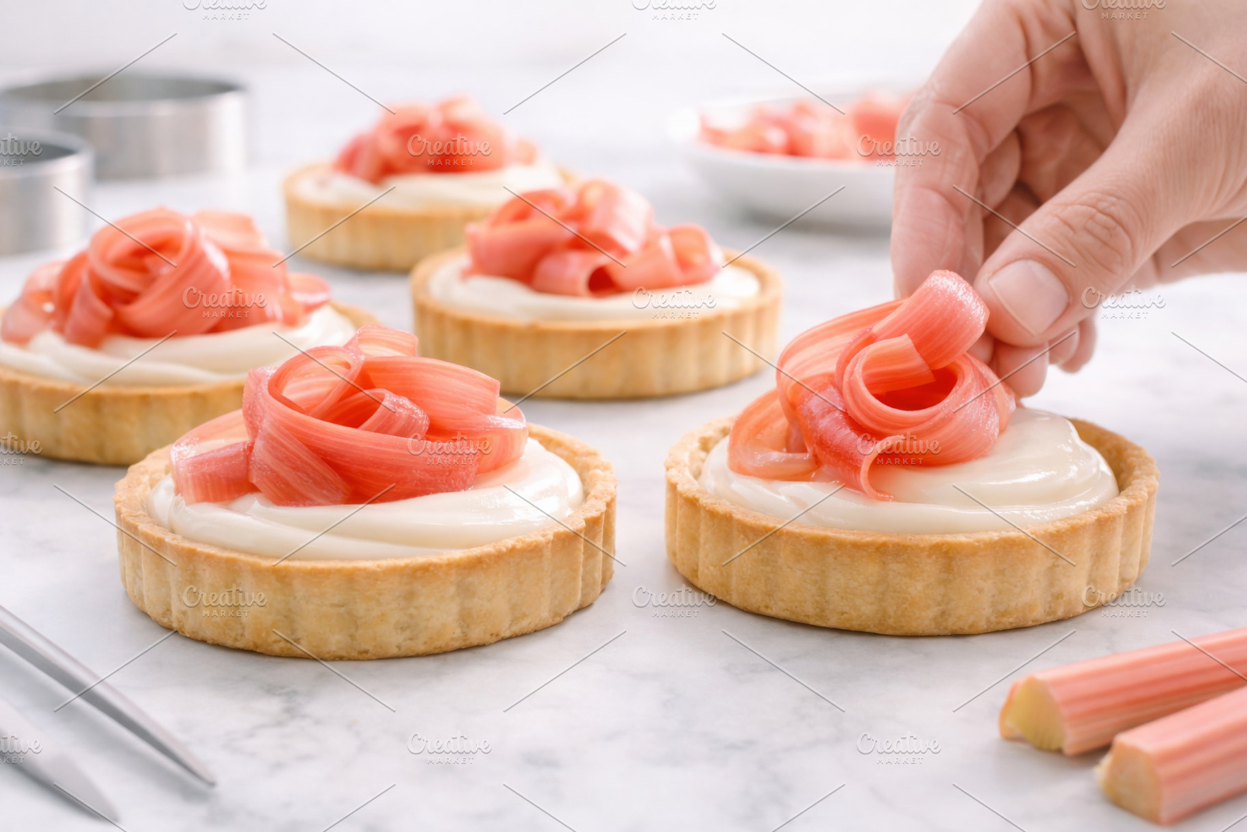 Rhubarb tarts on white marble backgr, a Photo by Dvoevnore photos