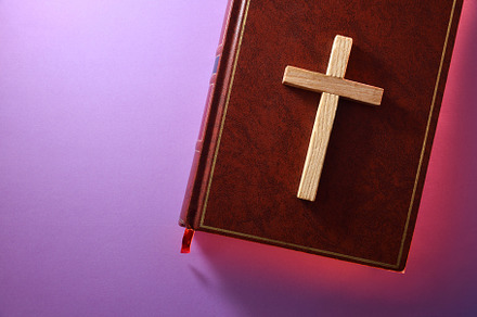 Bible with cross and red sparkle around on purple top, a School & Education Photo by Davizro's Market