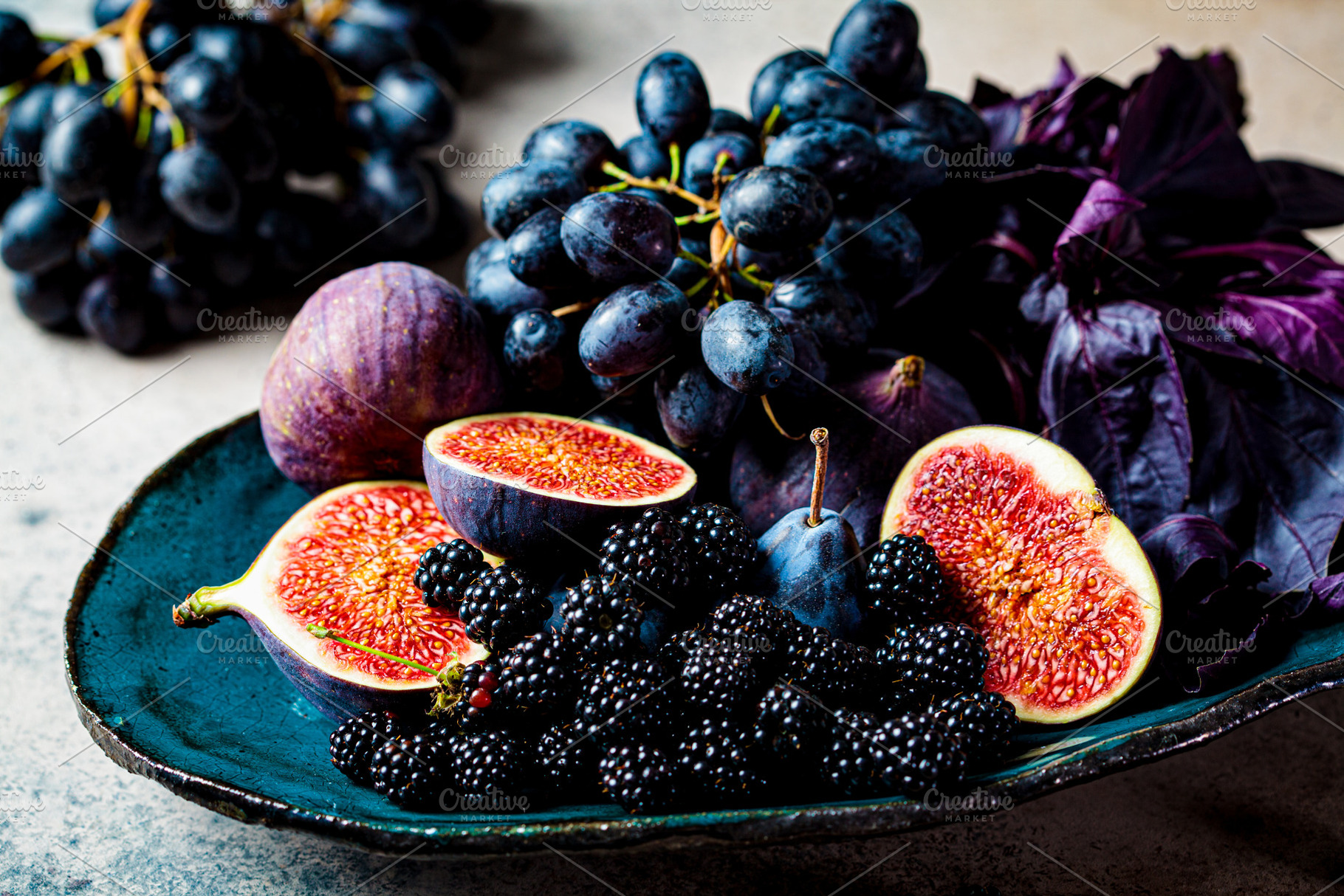 Purple fruits and berries containing assortment, basil, and blackberries, a Food & Drink Photo by vaaseenaa