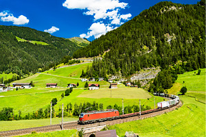 Trucks crossing the Alps by rail in, a Transportation Photo by Leonid Andronov